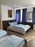 Postel nebo postele na pokoji v ubytování Hotel Guntia Boardinghouse