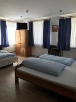 Postel nebo postele na pokoji v ubytování Hotel Guntia Boardinghouse