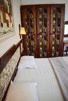A bed or beds in a room at Family Hotel Apolonia