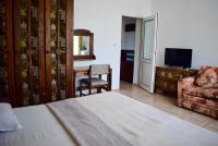 A television and/or entertainment centre at Family Hotel Apolonia