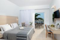Łóżko lub łóżka w pokoju w obiekcie Grand Hotel Holiday Resort