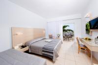 Łóżko lub łóżka w pokoju w obiekcie Grand Hotel Holiday Resort