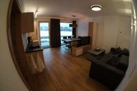 Televízia a/alebo spoločenská miestnosť v ubytovaní Appartements Klotz