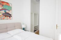Postel nebo postele na pokoji v ubytování Studio Apartments Urania - Mai's Apartments