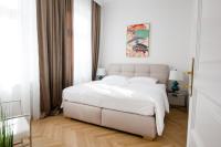Postel nebo postele na pokoji v ubytování Studio Apartments Urania - Mai's Apartments