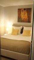 a bedroom with a large bed with yellow pillows at Esprit Bordelais in Bordeaux