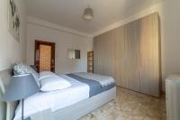 A bed or beds in a room at Bologna Fiera Fani Apartment