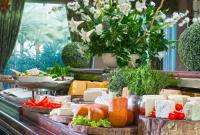 a buffet of cheese and vegetables on a table at Herods Palace Hotels & Spa Eilat a Premium collection by Fattal Hotels in Eilat