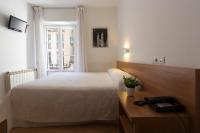 Postel nebo postele na pokoji v ubytování Hostal La Numantina