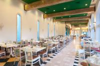 a dining room with white tables and chairs at Herods Palace Hotels & Spa Eilat a Premium collection by Fattal Hotels in Eilat