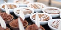 a bunch of cupcakes in white bowls with chocolate at Herods Palace Hotels & Spa Eilat a Premium collection by Fattal Hotels in Eilat