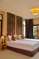 a bedroom with a large bed in a room at Palm Leaf Resort Koh Tao in Ko Tao