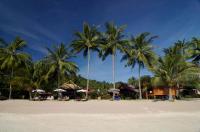 a group of palm trees on a sandy beach at Palm Leaf Resort Koh Tao in Ko Tao