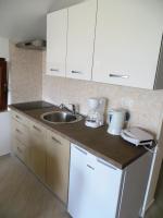 Kuchyňa alebo kuchynka v ubytovaní Apartmani Gracijela