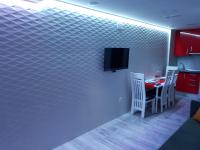 A television and/or entertainment centre at Apartamentos Sueños de Toledo