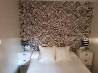 A bed or beds in a room at Apartamentos Sueños de Toledo