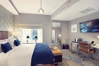 a large bedroom with a large bed and a desk at Artezen Hotel in New York