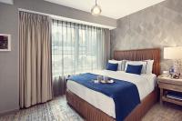 a bedroom with a large bed and a window at Artezen Hotel in New York