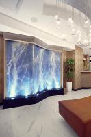 a large aquarium in the lobby of a hotel at Artezen Hotel in New York