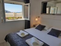 Posteľ alebo postele v izbe v ubytovaní S & V Deluxe Apartments