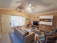 A television and/or entertainment centre at VILLA OLIVEIRA by Buenavilla