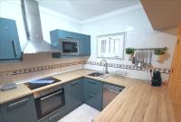 A kitchen or kitchenette at VILLA OLIVEIRA by Buenavilla