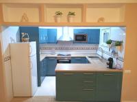 A kitchen or kitchenette at VILLA OLIVEIRA by Buenavilla
