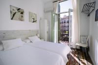 Postel nebo postele na pokoji v ubytování Hostal Eixample