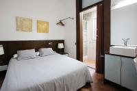 Postel nebo postele na pokoji v ubytování Hostal Eixample
