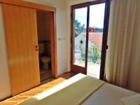 Postel nebo postele na pokoji v ubytování Apartments SIDRO on the beachfront
