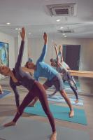 a group of people in a yoga class at Artezen Hotel in New York