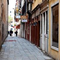 an empty street in a city with buildings at Hotel Florida in Venice