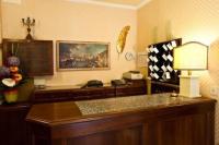 a kitchen with a counter with a lamp and a table at Hotel Florida in Venice