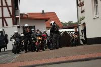 a group of people on motorcycles parked on a street at Hotel-Gasthaus-Kraft in Schauenburg