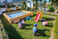 a group of toys in the grass next to a pool at Avica Homestay in Wujie