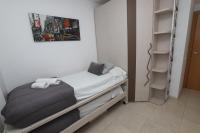 A bed or beds in a room at DIFFERENTFLATS Paradise Village Families