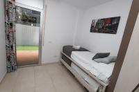 A bed or beds in a room at DIFFERENTFLATS Paradise Village Families