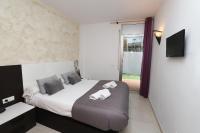 A bed or beds in a room at DIFFERENTFLATS Paradise Village Families