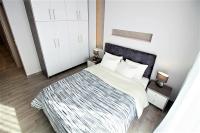 Postel nebo postele na pokoji v ubytování Metro Apartment