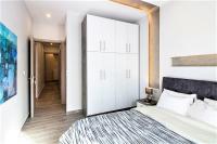 Postel nebo postele na pokoji v ubytování Metro Apartment