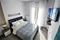Postel nebo postele na pokoji v ubytování Metro Apartment