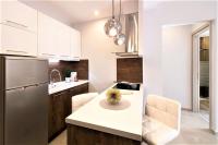Kuchyň nebo kuchyňský kout v ubytování Metro Apartment