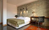 A bed or beds in a room at Hotel Casa del Abad
