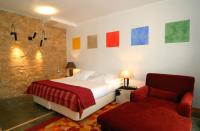 A bed or beds in a room at Hotel Casa del Abad