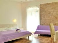 Posteľ alebo postele v izbe v ubytovaní Medulić Palace Rooms & Apartments