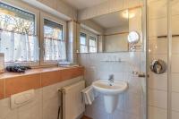 a bathroom with a sink and a shower at Haus am Blauenbach in Schliengen