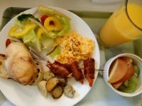 a plate of food with a salad and a drink at Sunny Sun B&amp;B in Taitung City
