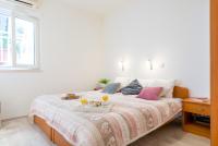 Posteľ alebo postele v izbe v ubytovaní Lily's Apartments