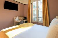 Hôtel de France, un hôtel AMMIにあるベッド