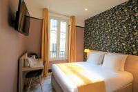 Hôtel de France, un hôtel AMMIにあるベッド